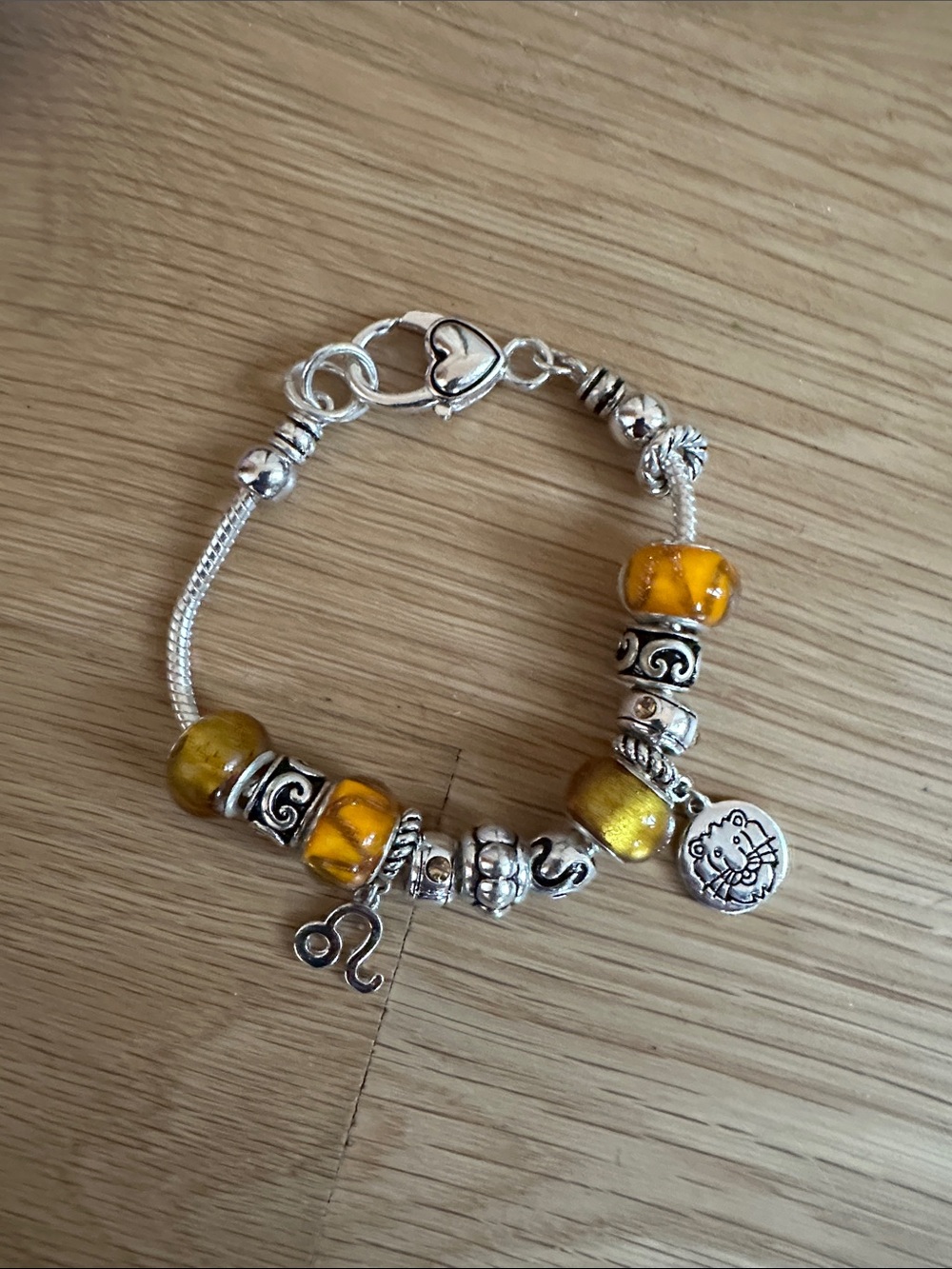 Landau Yellow Glass Bead Charm Bracelet with Leo and Silver Accents